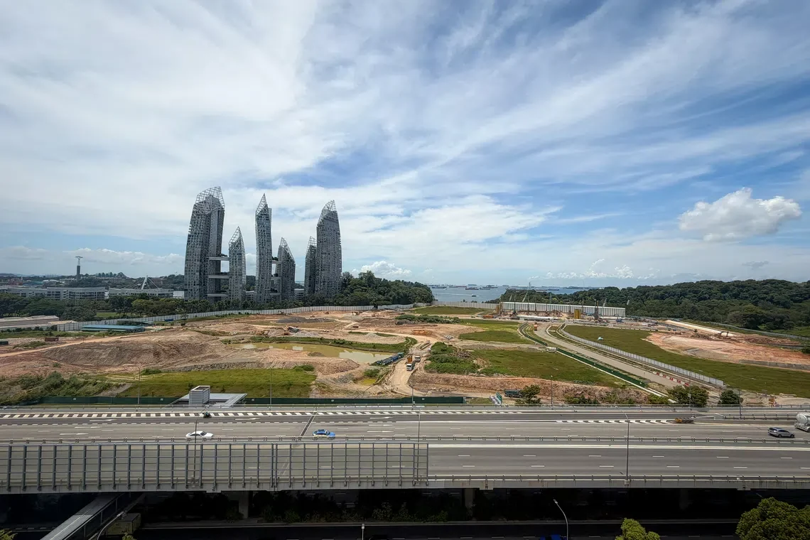 The cleared former Keppel Club golf course land in the Berlayar estate today, with the Reflections at Keppel Bay towers and the sea in the background